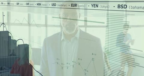 Focused Businessman Analyzing Digital Financial Charts on Glass Wall