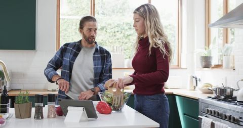Couple Preparing Dinner Together in Modern Kitchen