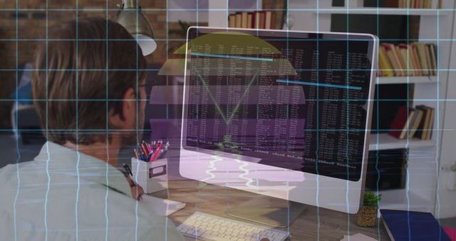 Software developer coding at modern home office desk