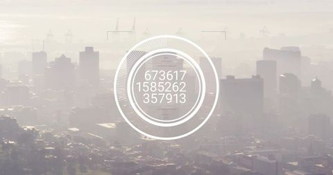 Futuristic hud interface overlaying misty urban skyline with concentric data rings