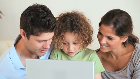 Sweet Family Bonding Moment with Laptop Technology