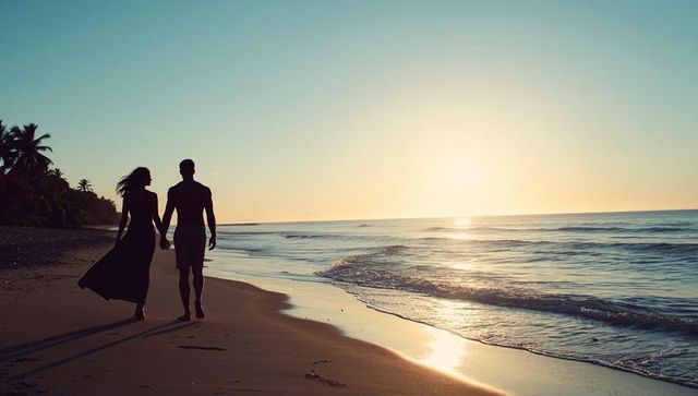 Couple Walking on Beach at Sunset Holding Hands Enjoy Romantic Tropical Leisure