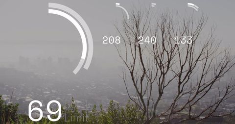 Digital Data Overlay on Misty Cityscape with Bar Graphs