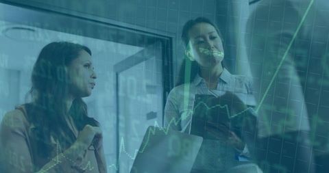 Three businesswomen discussing stock market analytics with tablet and rising chart overlay