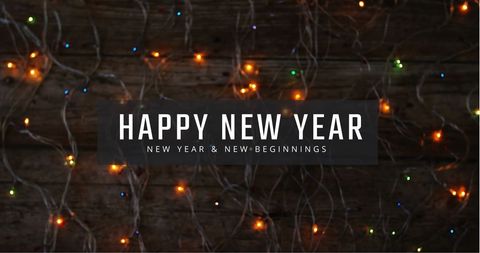 Happy New Year Text with Festive Fairy Lights on Dark Background - Download Free Stock Images Pikwizard.com