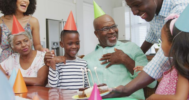 Image of happy african american family at a birthday party. Family life, spending time together with family.