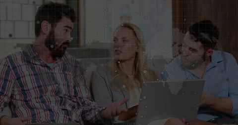 Team Discussing Ideas Indoors with Laptop in Modern Casual Atmosphere