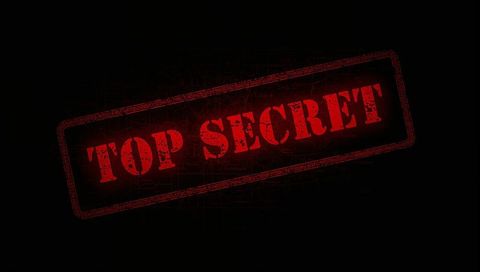 Red top secret stamp rotating on black canvas with grunge border digital grid texture