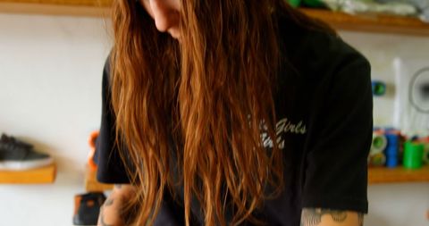 Young woman with long wavy hair in casual environment