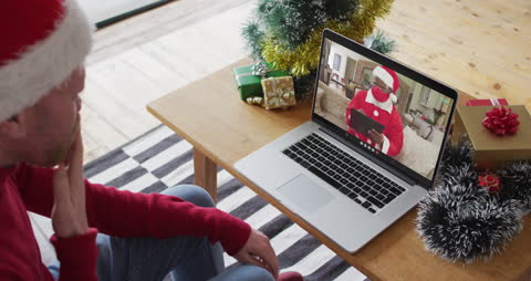 Online Christmas Video Call with Santa on Laptop at Home