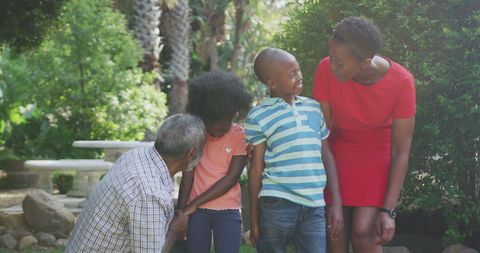 Joyful Family Gathering in Lush Garden Setting