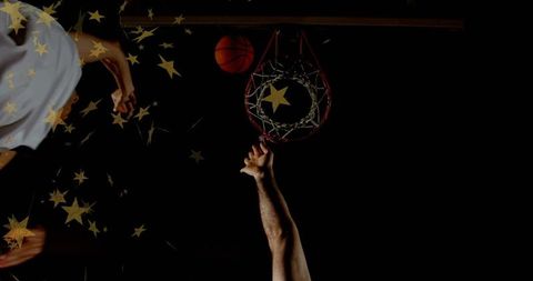 Basketball Players Reaching Hoops Amidst Shining Gold Stars