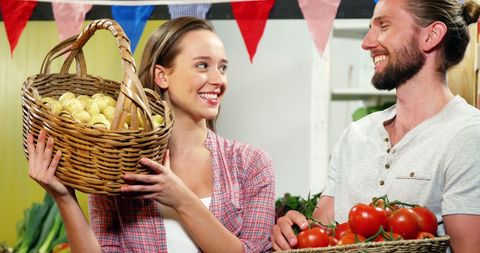 Couple Enjoying Shopping at a Vibrant Farmers Market