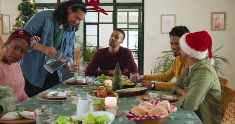 Diverse Friends Celebrating Holiday Meal Together