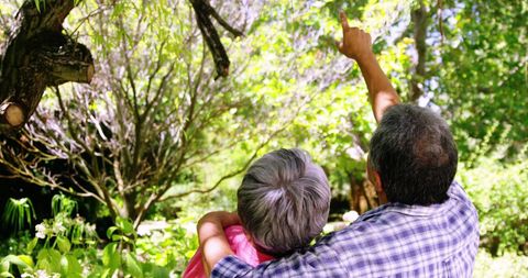 Senior Couple Enjoying Nature in Lush Garden Embracing Serenity