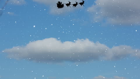 Santa Claus Sleigh with Reindeer Flying in Snowy Sky