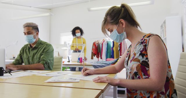 Designers Working with Masks in Modern Office During Pandemic - Download Free Stock Images Pikwizard.com