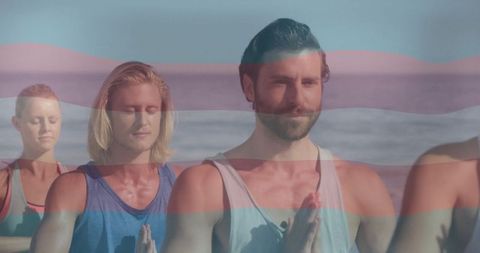 Group Meditating on Beach with Tranquil Smiles and Serenity