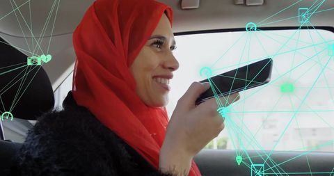 Woman Using Voice Assistant in Car with Digital Network Overlay