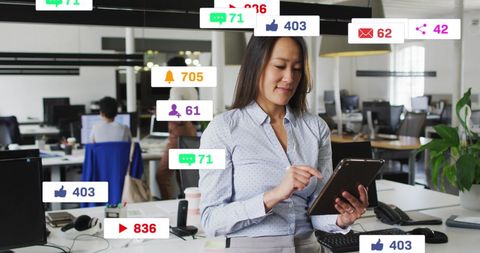 Businesswoman Engaged with Social Media in Office