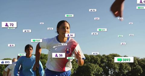 Young female soccer players running toward lens with social media engagement overlays