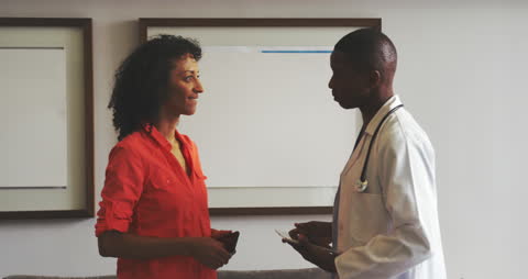 Doctor and Patient Engaging in Hospital Discussion