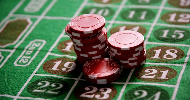 Casino chips on roulette on poker table in casino 