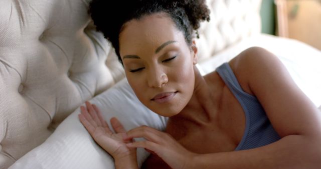 Woman Resting on Bed with Peaceful Expression - Download Free Stock Images Pikwizard.com