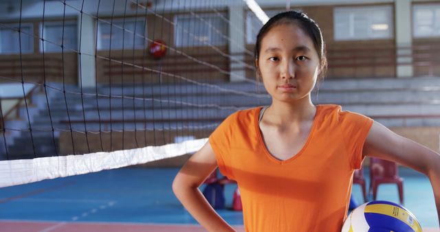 Confident Teenage Girl Holding Volleyball in Gym - Download Free Stock Images Pikwizard.com