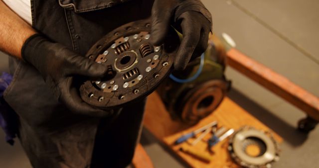 Mechanic Inspecting Vehicle Clutch Plate in Workshop - Download Free Stock Images Pikwizard.com