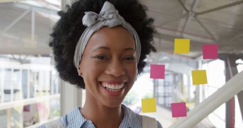 Cheerful african american woman smiling in modern office