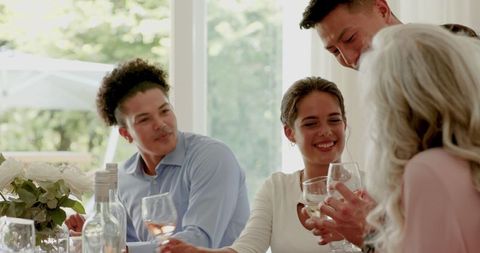 Friends Toasting Happily at Wedding Celebration