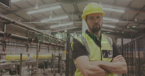 Factory worker in safety gear highlighting industrial encryption