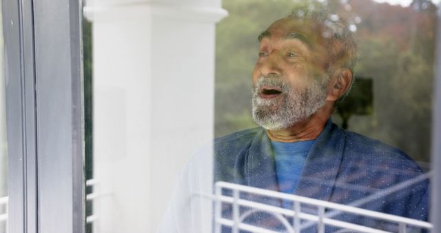 Elderly Man Expressing Surprise While Standing by Window - Download Free Stock Images Pikwizard.com