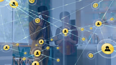 Diverse Colleagues Discussing Network Technology in Modern Office