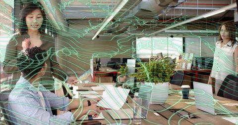 Team Collaborating in Open-Plan Office with Airflow Visualization for Workspace Planning
