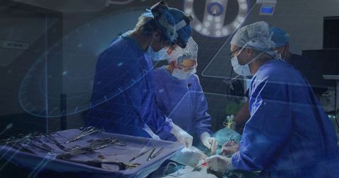 Surgical team performing precise operation in sterile environment