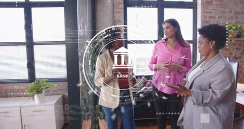 Professional women collaborating with digital banking interface