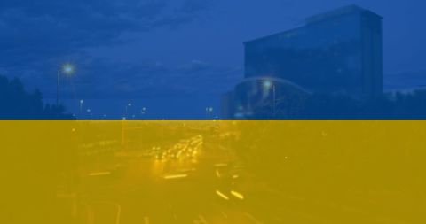 Flag of Ukraine Over Cityscape With Traffic and Political Theme