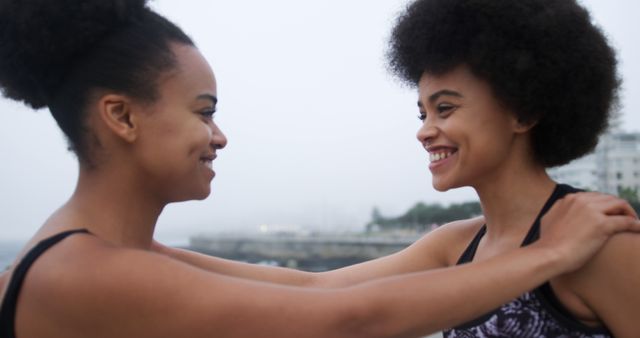 Two Friends Embracing Outdoors Smiling - Download Free Stock Images Pikwizard.com