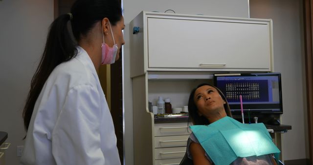 Dentist Attending to Patient in Modern Dental Clinic - Download Free Stock Images Pikwizard.com