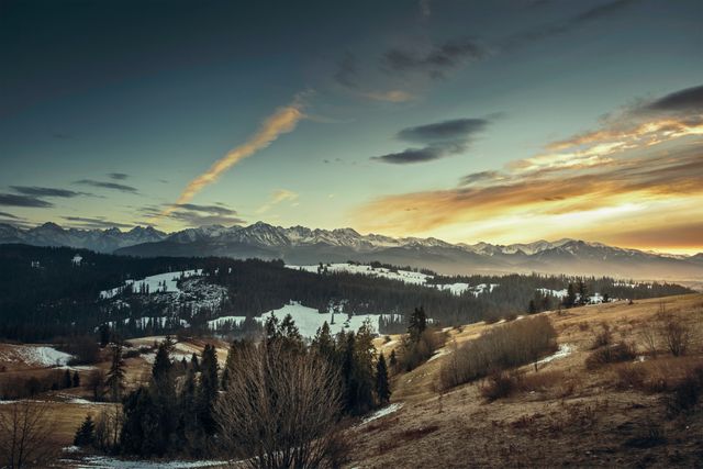 Winter Sunrise Over Snowy Mountain Range and Forest Hills - Download Free Stock Photos Pikwizard.com