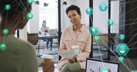 Woman Analyzing Data in Modern Office with Futuristic Visualization