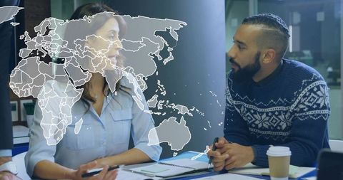 Multicultural Team Analyzing Global Business Strategy in Modern Office