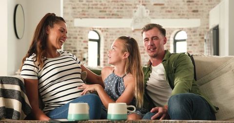 Happy Diverse Family Anticipating New Baby at Home