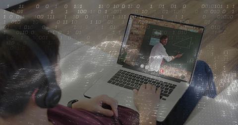 Teen Watching Virtual Math Lesson on Laptop Wearing Headphones with Binary Data Overlay
