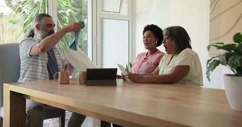Family celebrating pregnancy announcement together at home