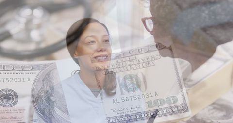 Female Doctor Consulting Senior Woman with Money and Healthcare Concept