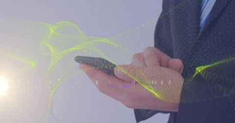 Businessman holding smartphone with neon data wave overlay for futuristic connectivity