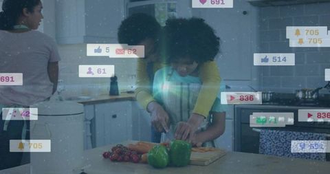Mother guiding child chopping peppers in kitchen with social media notification overlays